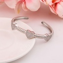Brazalete de corazon con zirconias baño 18k plat