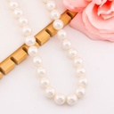 Collar bola chicle aperlado en concha nacar baño 18k