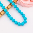 Collar bola chicle azul en concha nacar baño 18k