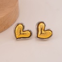Aretes stud de corazon doble tono baño 18k