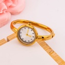 Reloj vintage redondo estilo brazalete en acero inoxidable