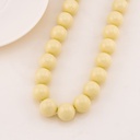 Collar bola chicle crema en concha nacar 14mm baño 18k